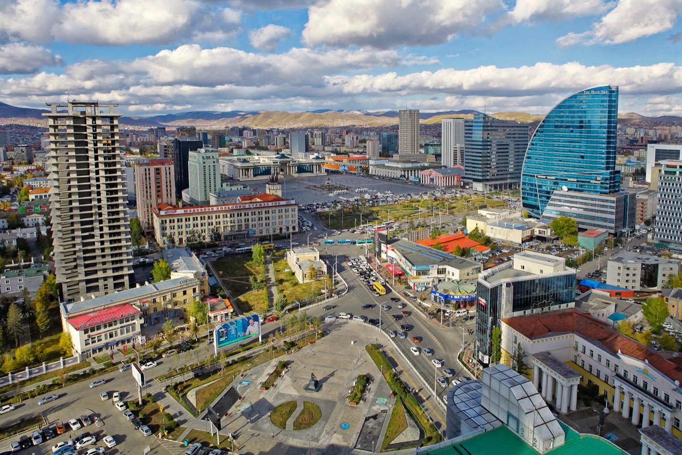 Aerial view of Ulaanbaatar's modern skyline framed by the surrounding hills